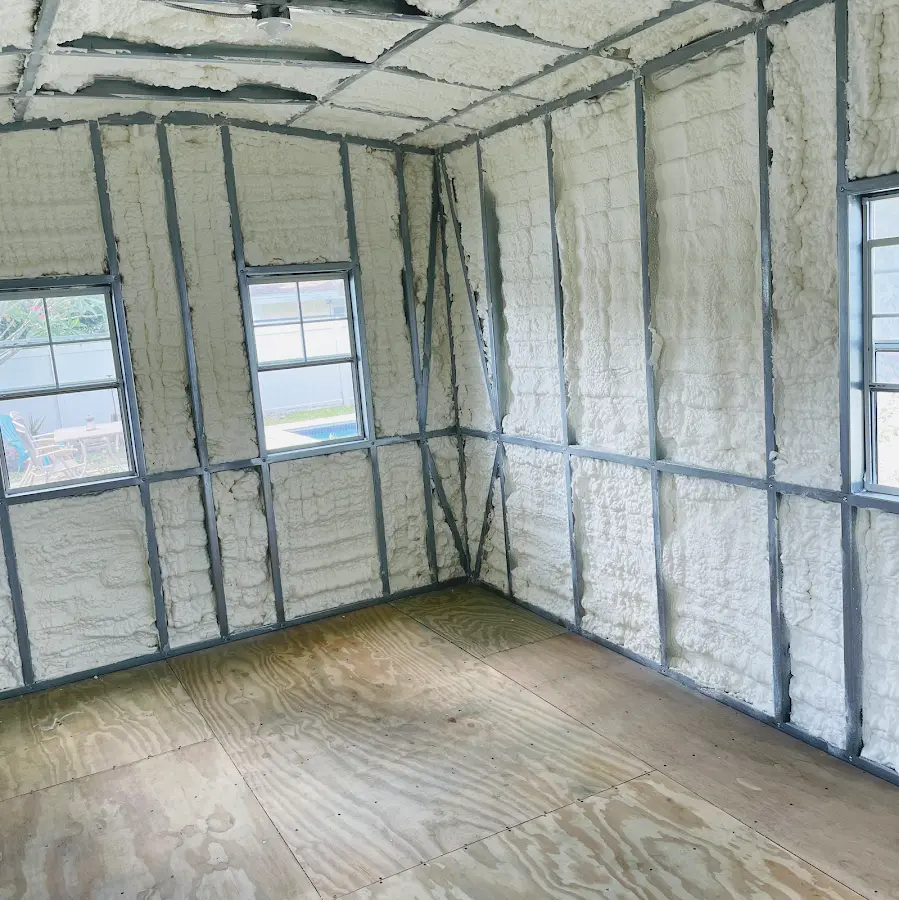 Closed-cell spray foam insulation applied to wall cavities in a residential project in Parkland